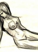 Nude model stands next to the machine